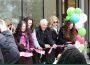A group of people participate in the ribbon-cutting ceremony at the kikaskihtânaw Centre.