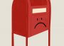 A red mailbox on a white background has a frowning face drawn on it.