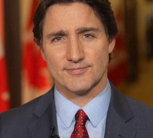 A photo of Justin Trudeau looking into the camera