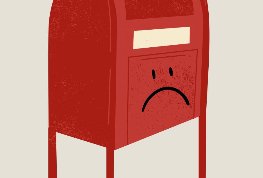 A red mailbox on a white background has a frowning face drawn on it.