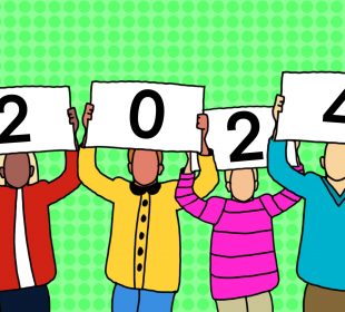 Four individuals in winter-type clothing hold up cards that form the number 2024.
