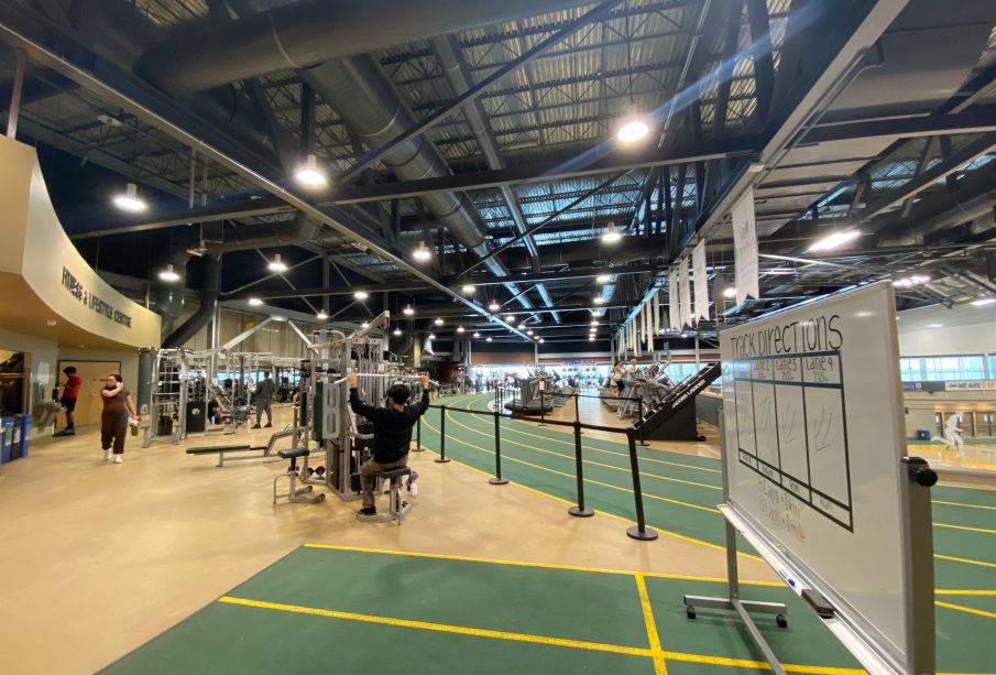A photo of the UR Fitness and Lifestyle Centre, from the entrance. Parts of the track and the weight machines are visible.