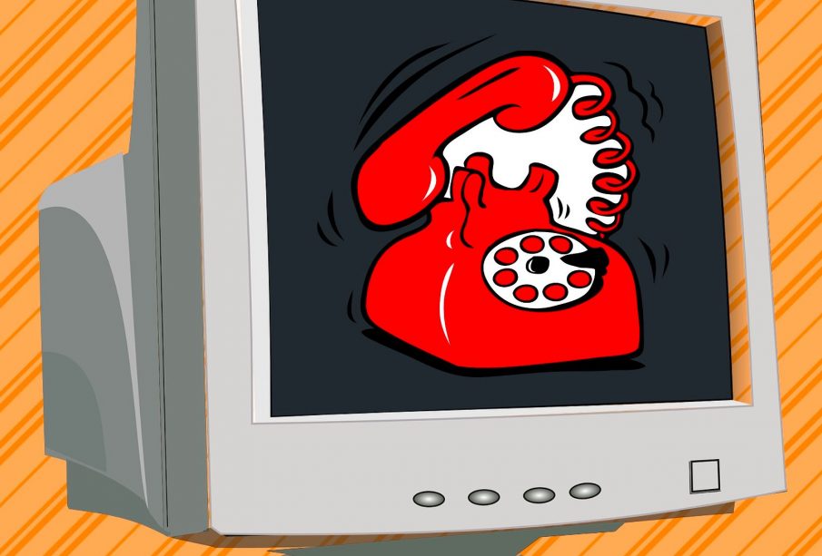 A visualization of the “Dial-up tone” on old computers as a play on words, with a brown box computer and a red corded landline rotary phone ringing on the screen.