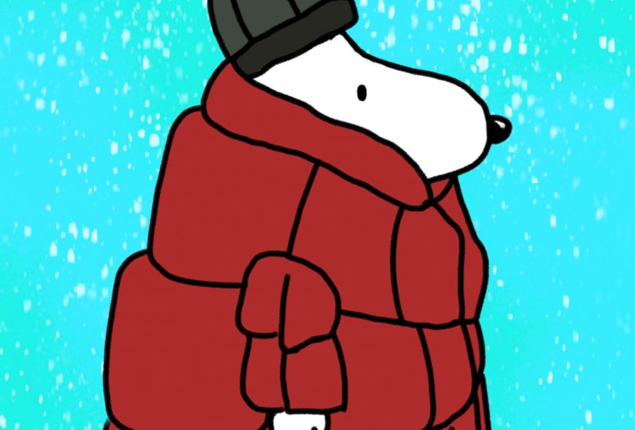A bipedal white dog, reminiscent of Peanuts Snoopy, wearing a large red coat and a green toque while it snows.