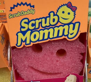 A photo of a scrub, boxed. The product label says Scrub Mommy and has a smiling emoji face.