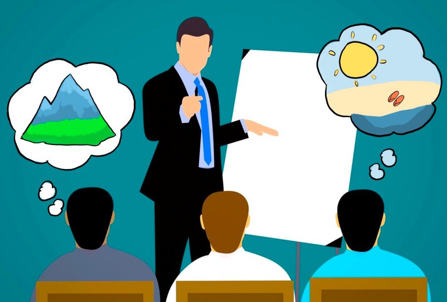 A sketch of a small classroom, with a teacher speaking to some students. Thought bubbles show the students dreaming of their passions.