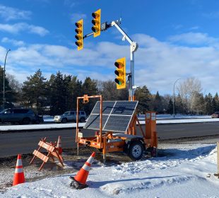A photo of the temporary replacement lights at the intersection that the accident occurred. The photograph was taken from the east side of the lights.