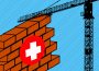 A section of a brick wall with a first aid sign on its front. A solid black silhouette of a crane is lifting the brick wall.