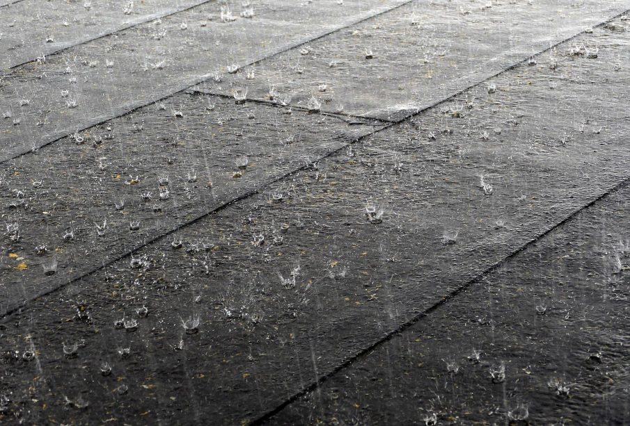 Rain torrents down onto pavement