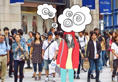 A photo of a person in a mask, in a crowd of other pedestrians. They look nervous and overcome with thoughts.