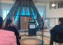 A photo is taken from the third row of the INCA announcement at FNUniv. FNUniv student Brittany Poitras makes a statement on the main floor of the university.