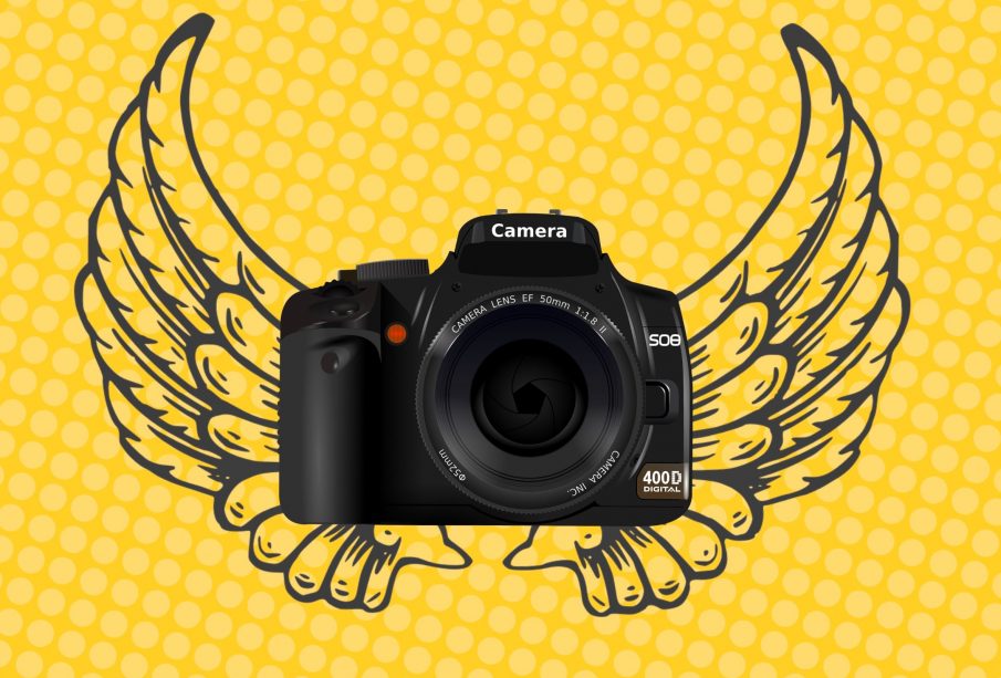An image of a handheld camera overlaid on an image of angel wings, with a yellow background.
