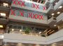 The windows of second, third, and fourth floor faculty offices in the Administration-Humanities building are seen from below. Large red “X”s cross out many of the offices 