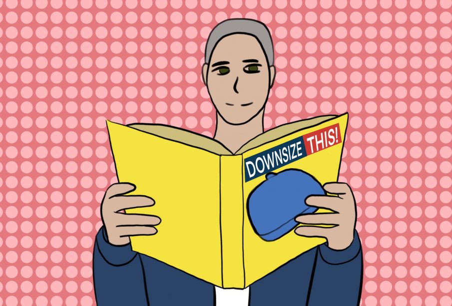 A person sits reading Michael Moore’s book Downsize This!