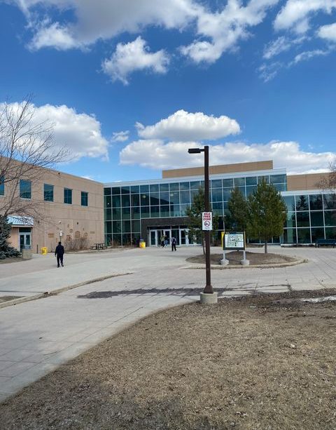 A photo showing the entrance to the Riddell Centre on a nice, sunny day.