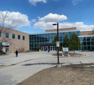 A photo showing the entrance to the Riddell Centre on a nice, sunny day.