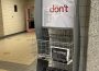 A photo of a Carillon newspaper stand. Some issues are folded and stocked.