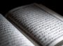 A photo of the Quran, open to a page.
