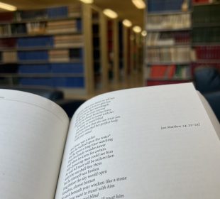 A book is open to Leonard Cohen’s “Suzanne”