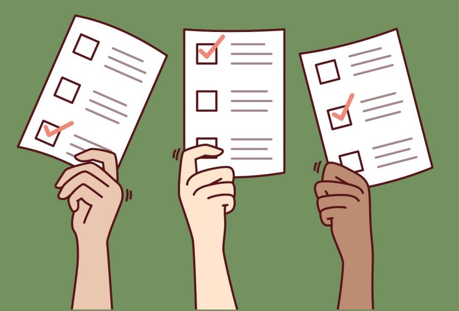 Three hands hold up their ballots, the ballots have no text, but have boxes with check-marks through them