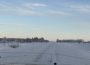 A photo showing the landscape covered in snow as far as one can see.
