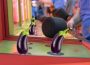 The game whack-a-mole set in an arcade, with several eggplants edited to sit over the holes the moles would come out of