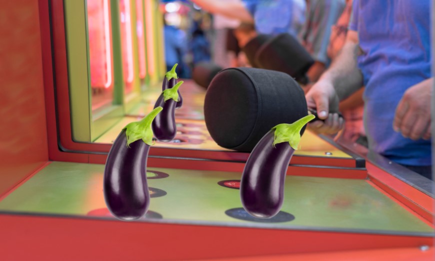 The game whack-a-mole set in an arcade, with several eggplants edited to sit over the holes the moles would come out of