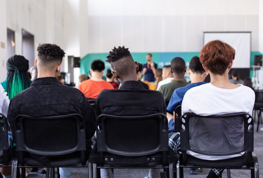 View of a classroom full of students from the back