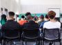 View of a classroom full of students from the back