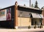 The Slate Art Gallery building from an angle, displaying both the entrance and the billboards for Summer Rhubarb and the next show, Maia Stark’s Unwell.