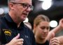 Cougars women’s basketball head coach Dave Taylor stands strategizing with and encouraging the team.