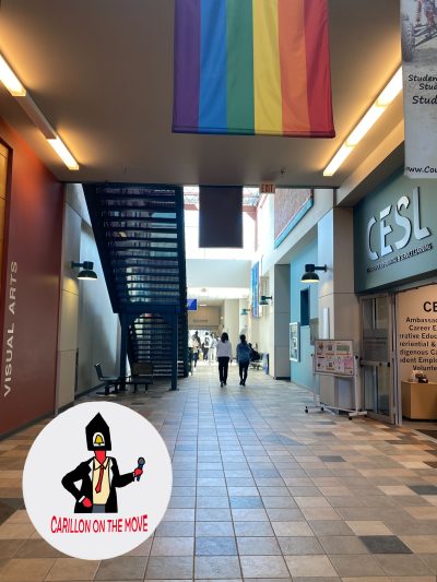 Students walk down the Riddell Centre hallway with the ‘Carillon on the Move’ logo stamped in the corner.