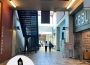 Students walk down the Riddell Centre hallway with the ‘Carillon on the Move’ logo stamped in the corner.
