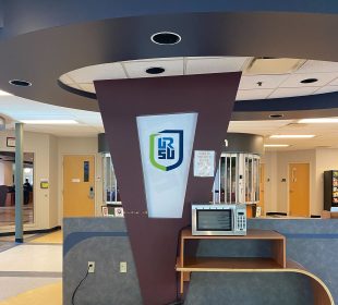 URSU logo sits on a glowing board near the URSU front desk