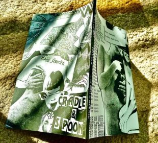 This is a photo of the physical copy of Cradle and Spoon. The cover looks almost like a comic, with exaggerated lines and a lot of action going on. The letters of the title are listed in blocks as a collage with the images of people included.