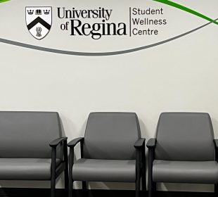 A picture of empty chairs in the waiting room for the Student Wellness Centre on campus.