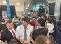 Justin Trudeau is swarmed by members of the town council as he makes his exit. 