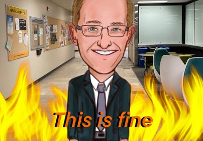 A caricature of Jeff Keshen, President of the University of Regina, who stands in the Classroom Building hallway on campus. The hallway behind him burns and the caption at the bottom reads ‘This is fine.’