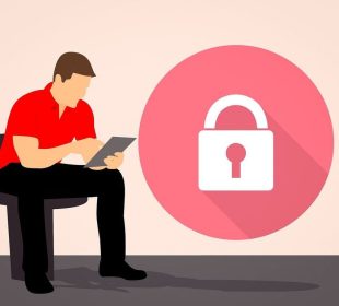 A person works on their iPad with difficulty as a large lock sits on the screen.