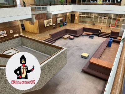 An empty AdHum pit sits desolate from a bird’s eye view. The Carillon the Move series logo sits in the left corner.