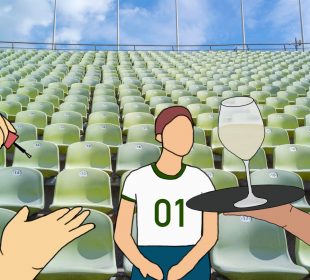 A spectator sits in a football stadium. Drinks are being served to them while someone does their nails.