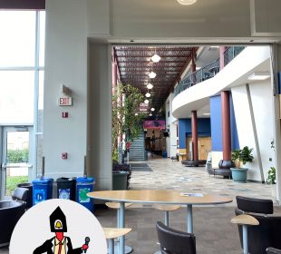 A photo taken from the south side of the Riddell Centre facing North through the main hallway, filled with sunlight and sporting the “Carillon on the move” series logo in the bottom left.