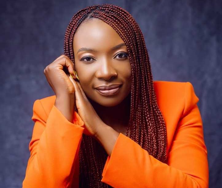 A profile shot of Shakirat Edoho, wearing an orange jacket.