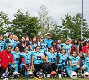A team photo of the U18 Indigenous women’s football team, with new coach Jill Fast.