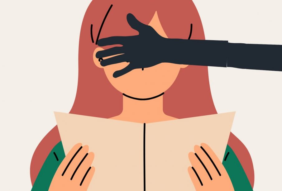 A young person with long red hair is reading a book, but a greyed-out arm is blocking their eyes from seeing the book.