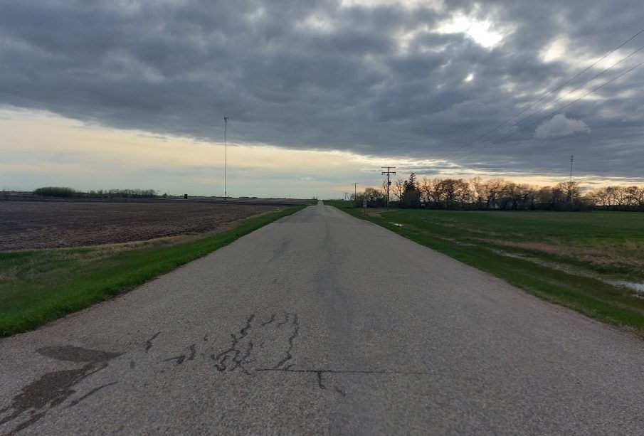 A photo of a Saskatchewan highway leading into the horizon.