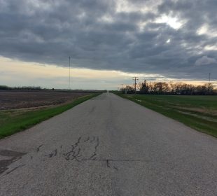 A photo of a Saskatchewan highway leading into the horizon.