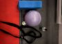 A photo of straps, an exercise ball and a yoga mat.