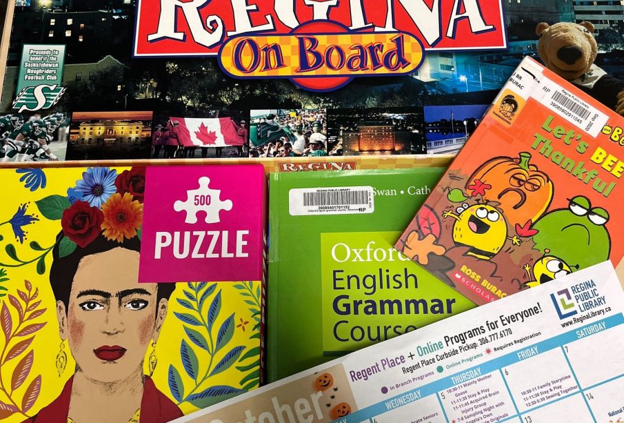 Board games, books, puzzles, and an activity schedule on a calendar page.