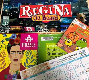 Board games, books, puzzles, and an activity schedule on a calendar page.